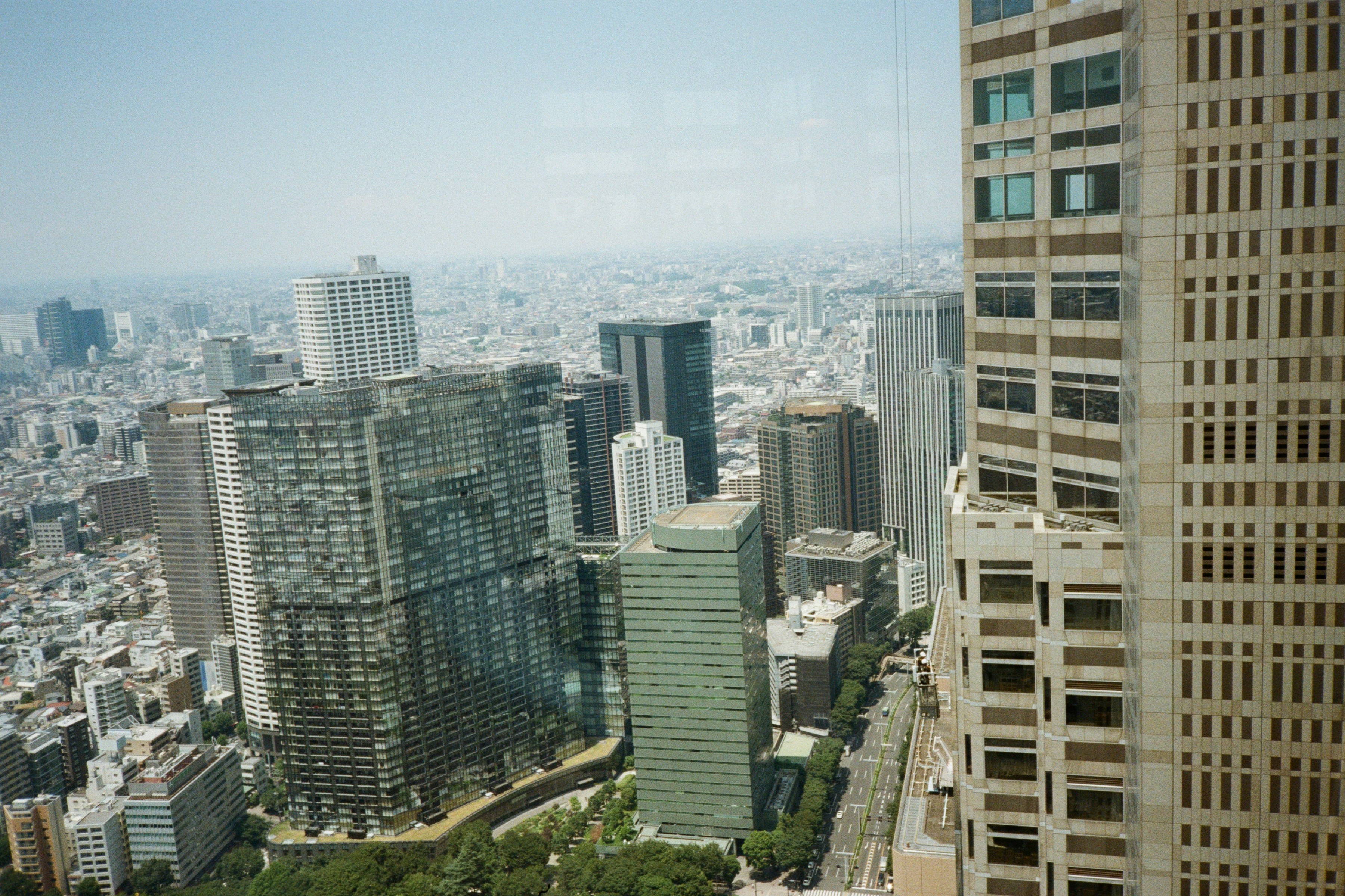 A view of a city from the top of a building