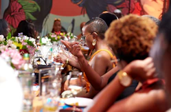 A group of people sitting at a long table