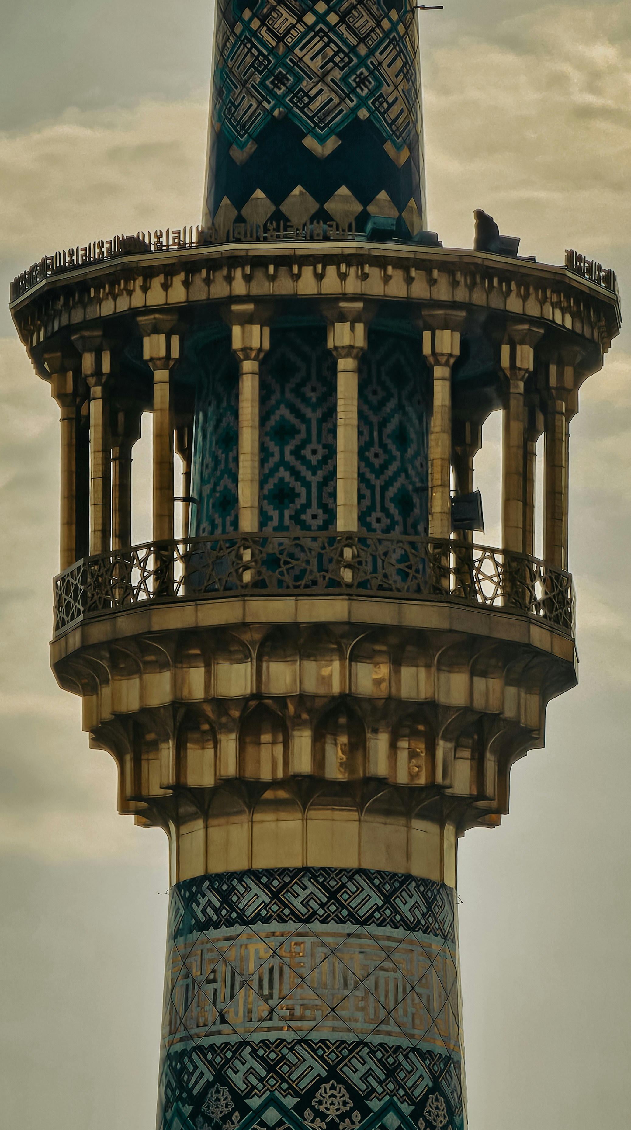 A tall tower with a clock on the top of it