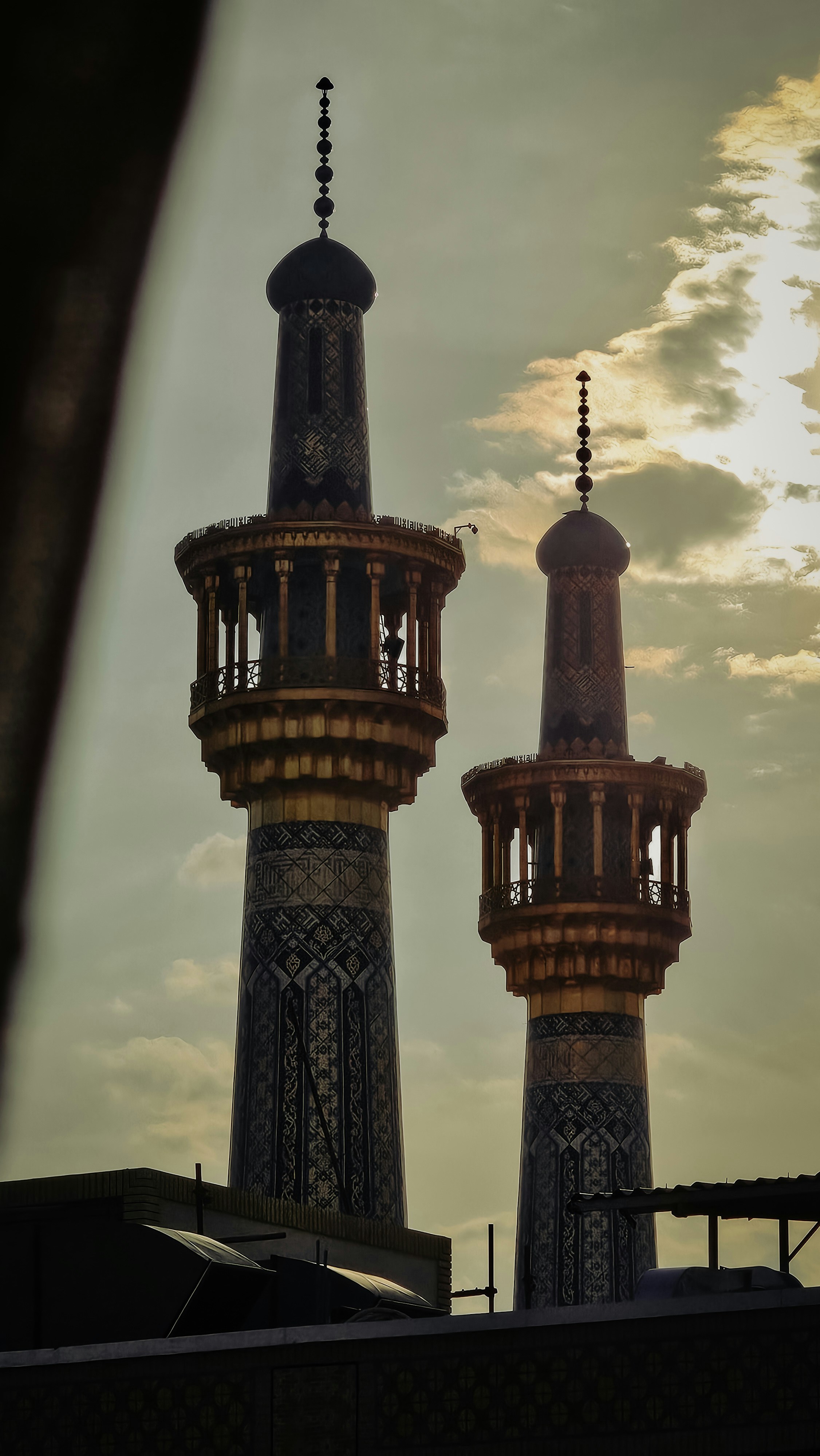 A couple of tall towers sitting next to each other