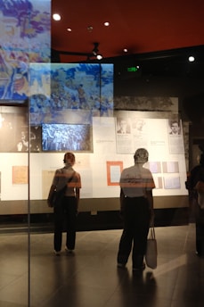A group of people standing in front of a display