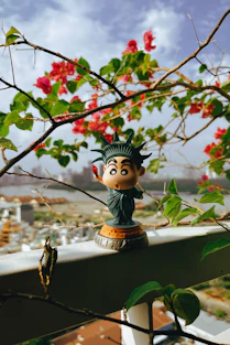 A small statue of liberty on a balcony