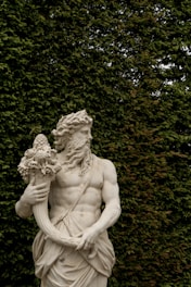 A statue of a man holding a flower
