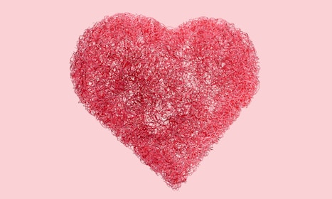 A pink heart on a pink background