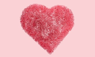A pink heart on a pink background