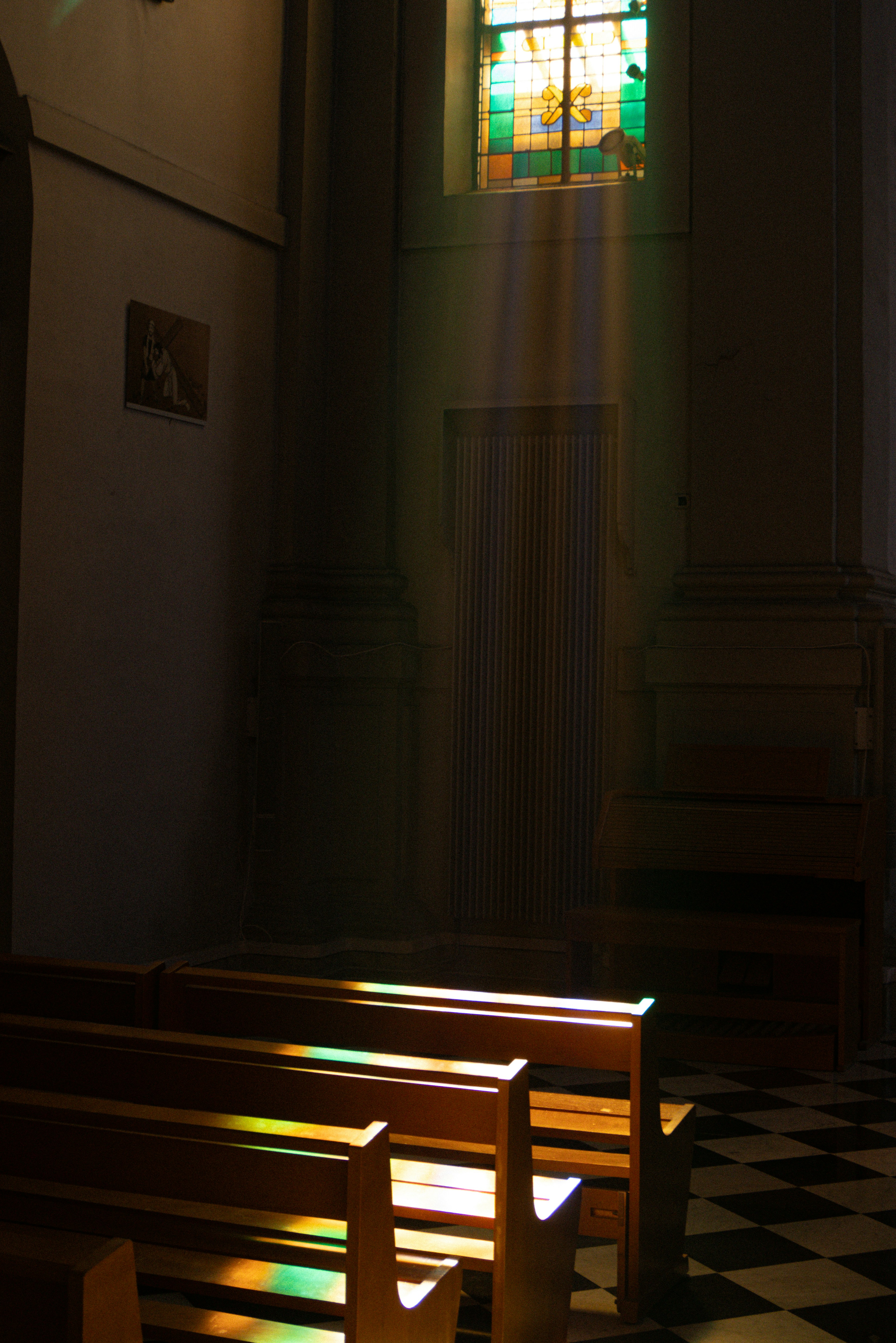 The sun is shining through a stained glass window