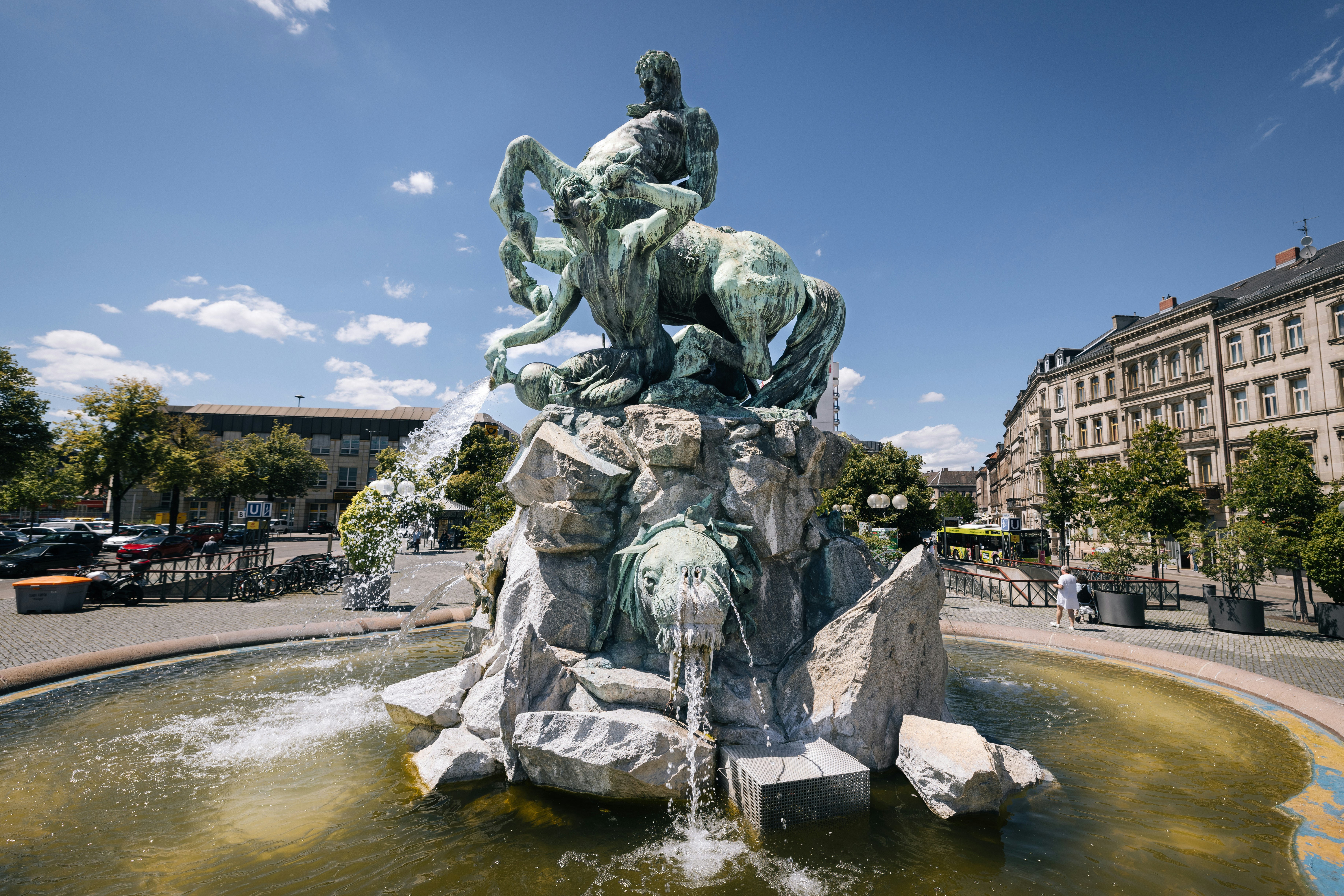 A fountain with a statue of a man riding a horse
