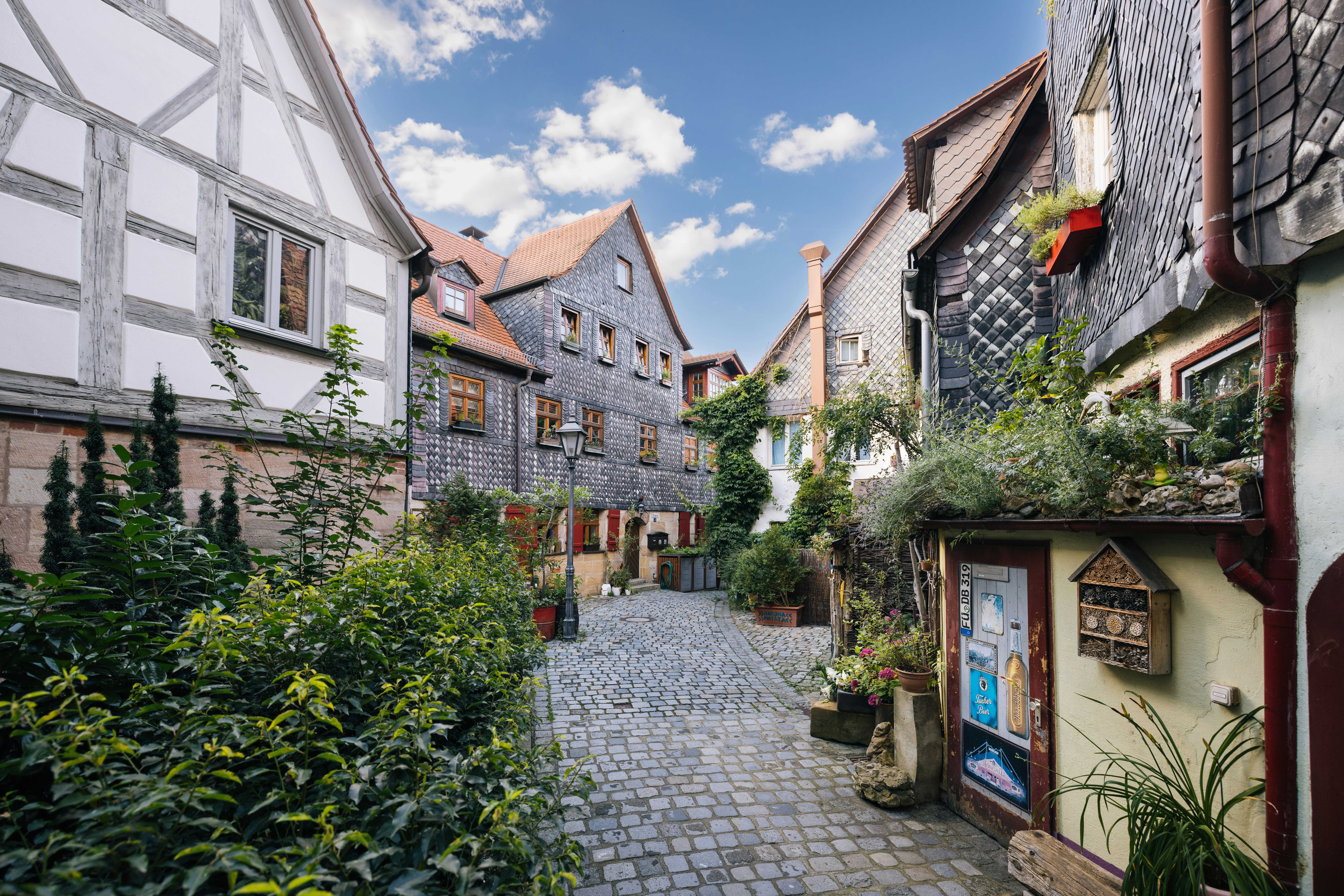 A narrow cobblestone street in a european village
