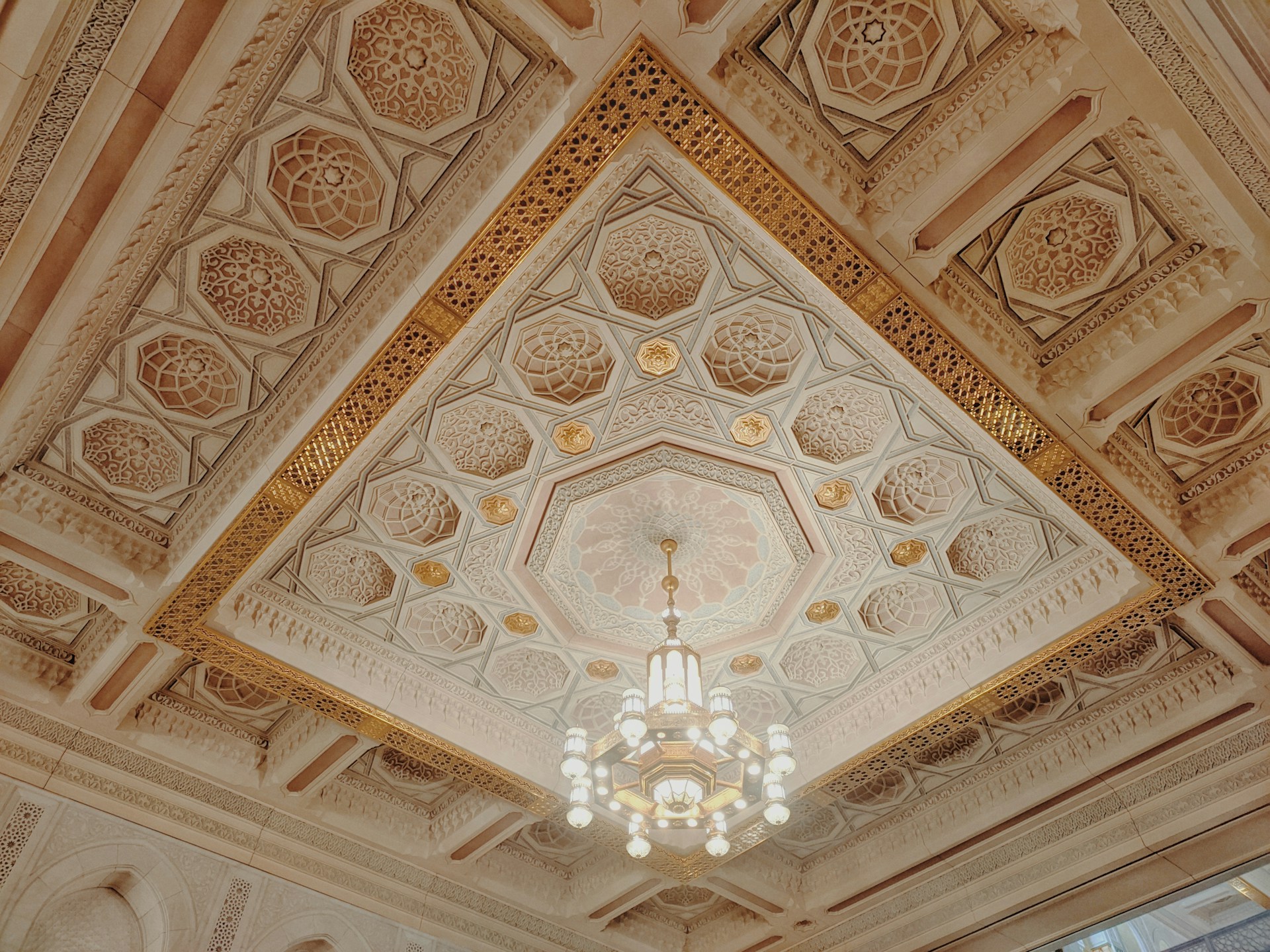 A chandelier hanging from the ceiling of a room