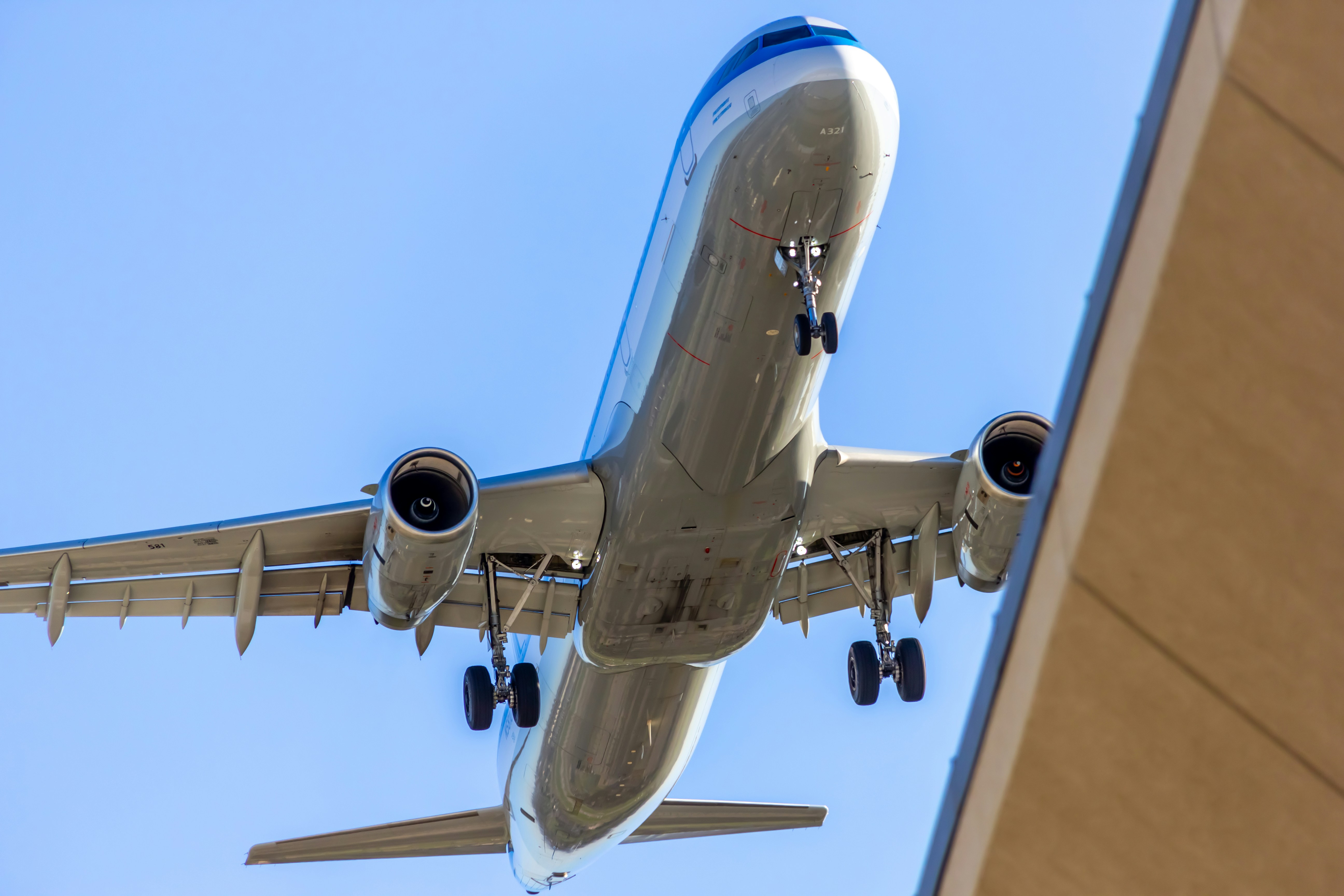 A large passenger jet flying through a blue sky