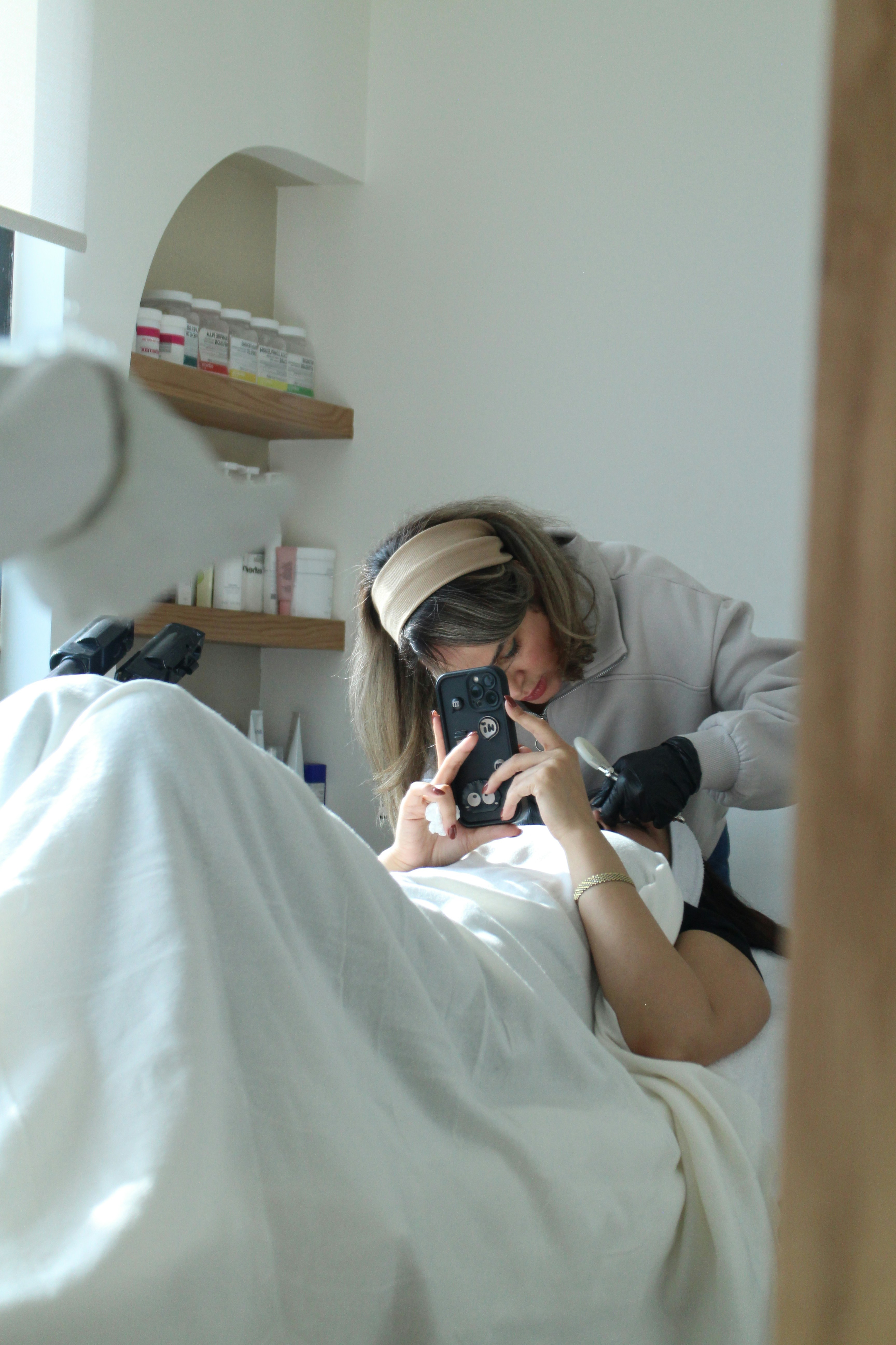 Woman applying a face mask at home