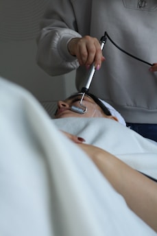 A woman getting her hair brushed by a hair stylist