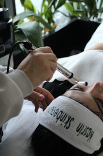 A woman getting her hair cut by a hair stylist
