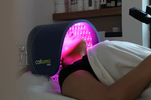 A woman laying on a bed with her head on a pillow