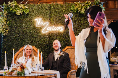 A woman taking a picture with her cell phone