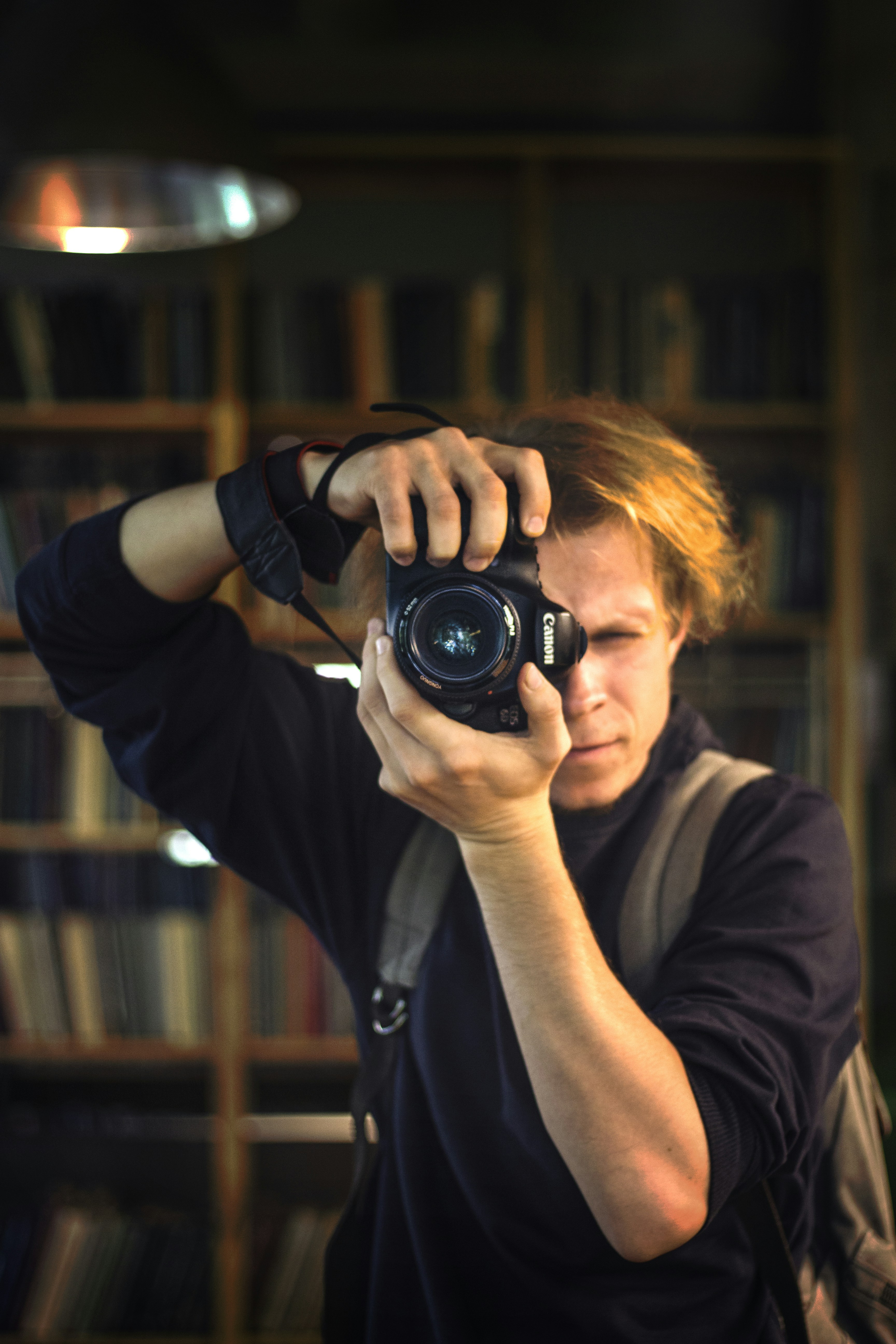 A man taking a picture of himself with a camera