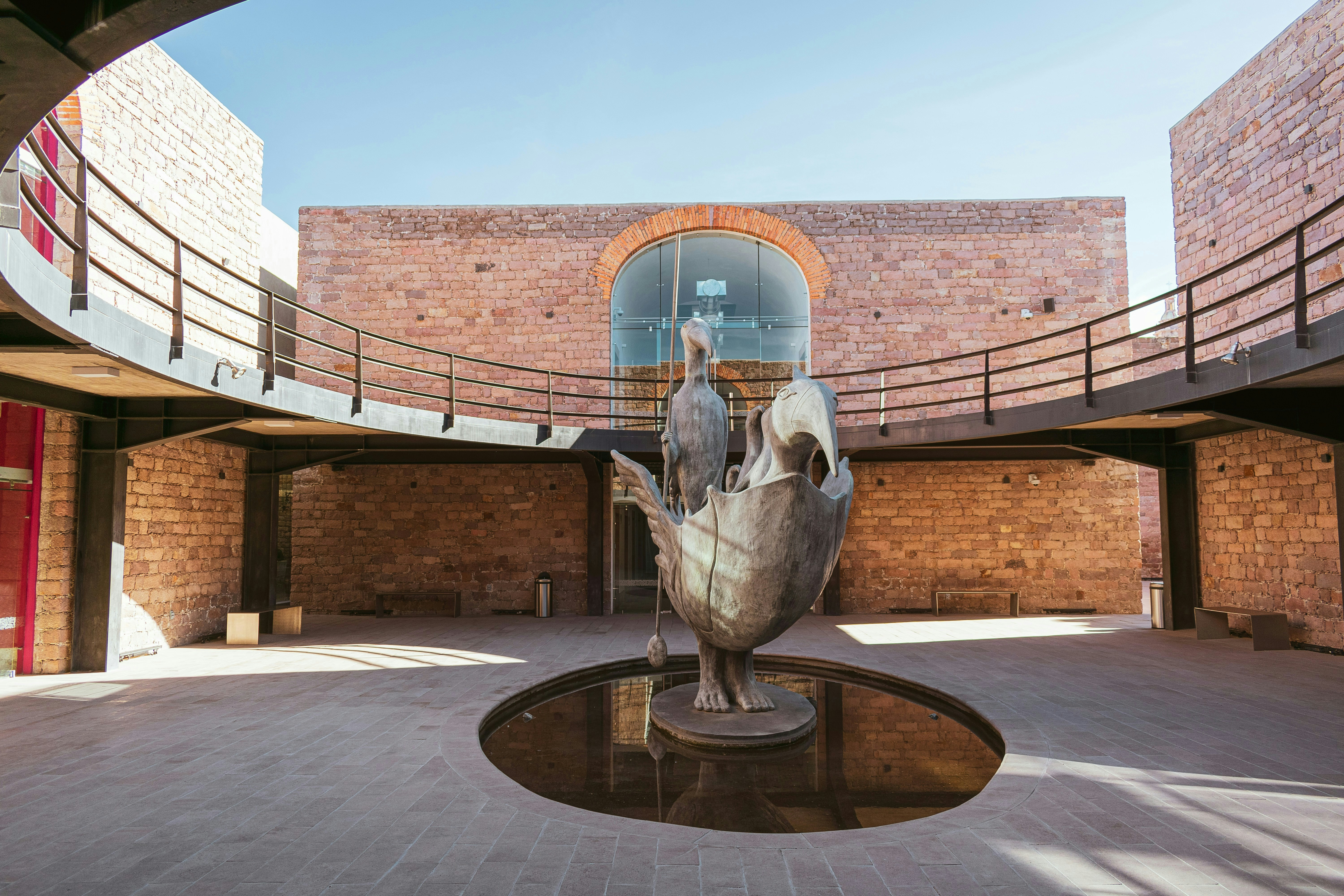 A statue of a bird in a courtyard