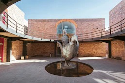 A statue of a bird in a courtyard