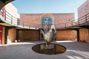 A statue of a bird in a courtyard