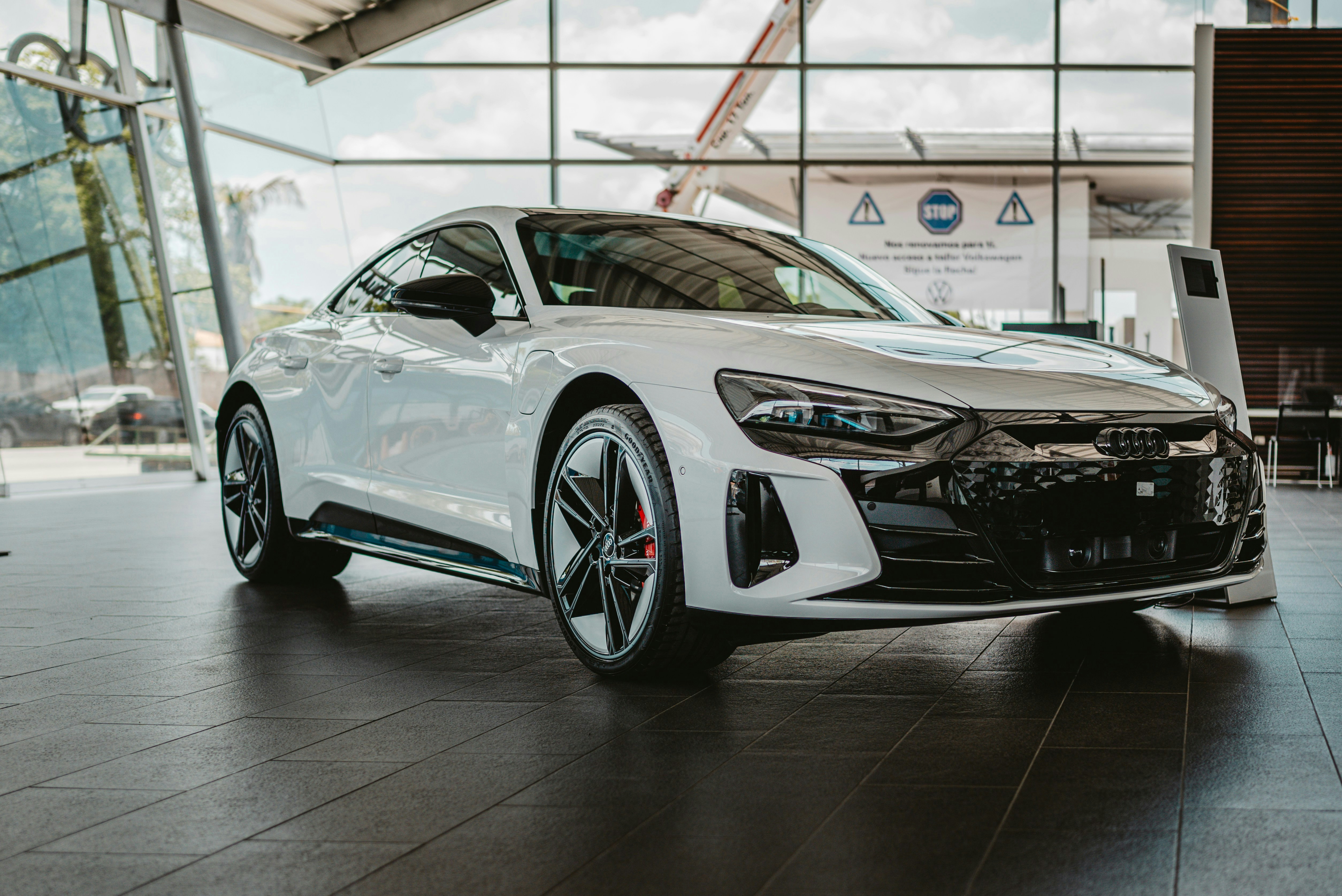 A white car parked inside of a building