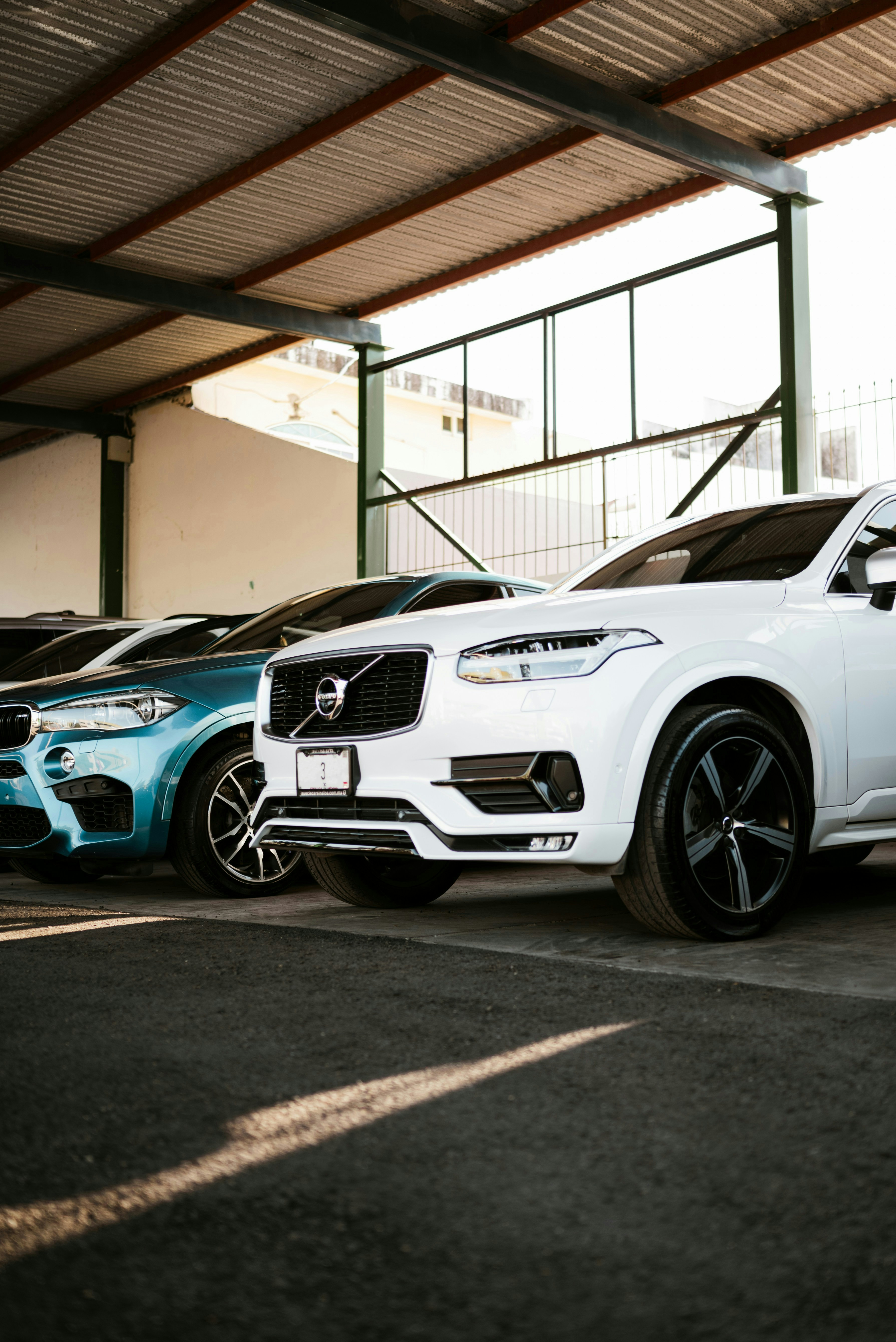 A row of cars parked in a garage