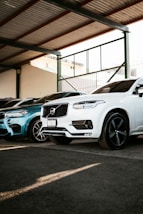 A row of cars parked in a garage