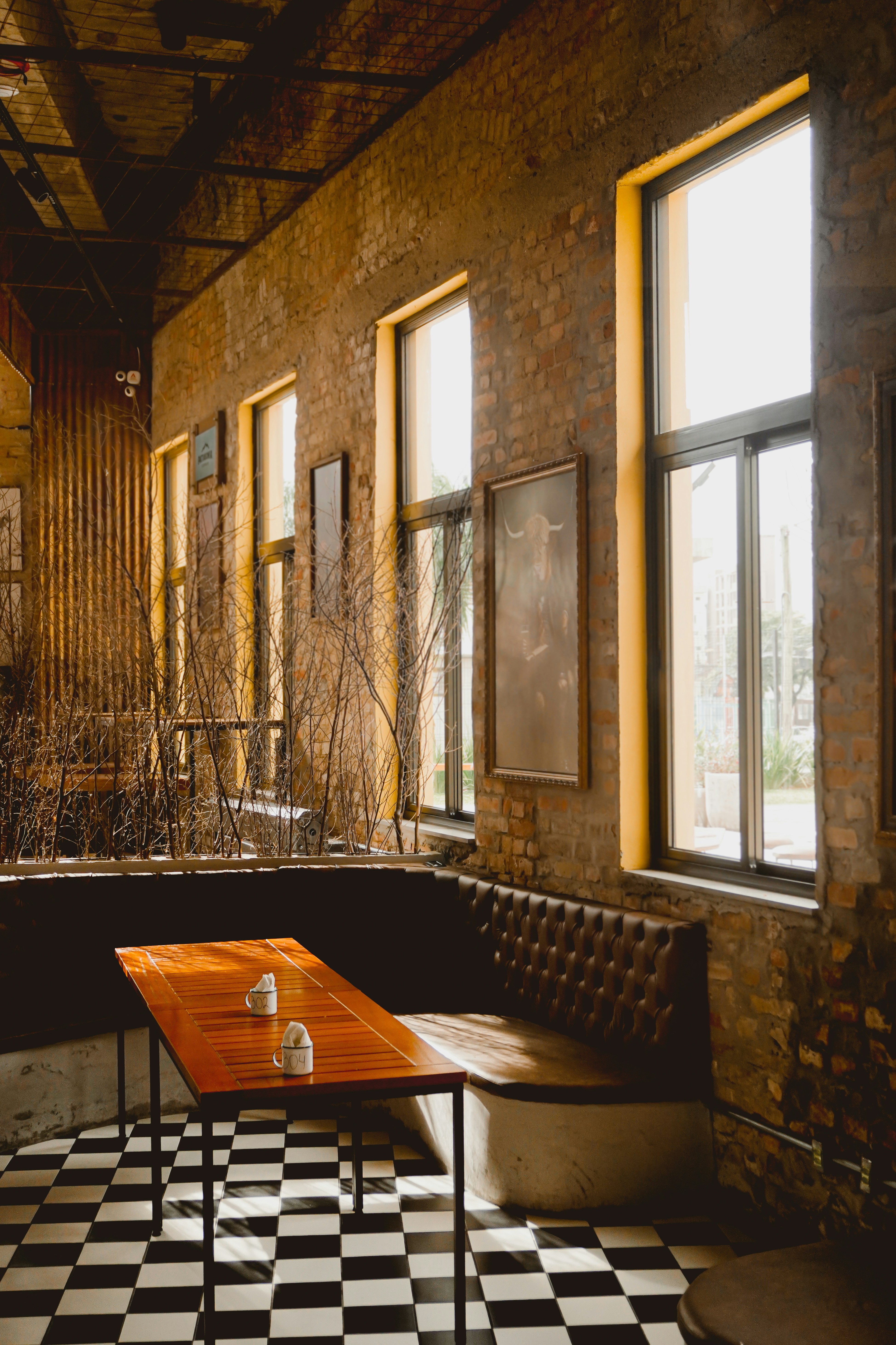 A room with a checkered floor and a bench