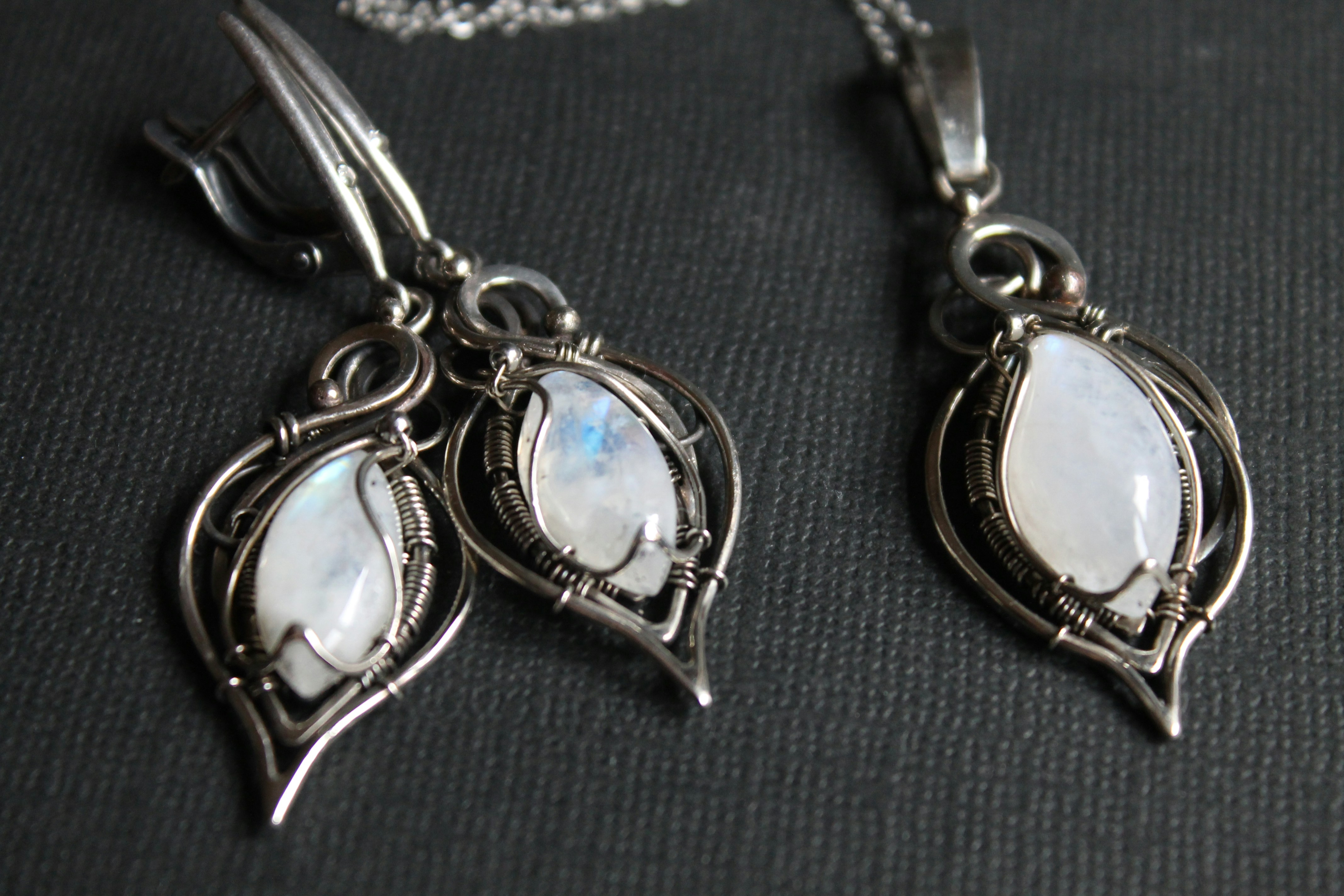 A couple of necklaces sitting on top of a table