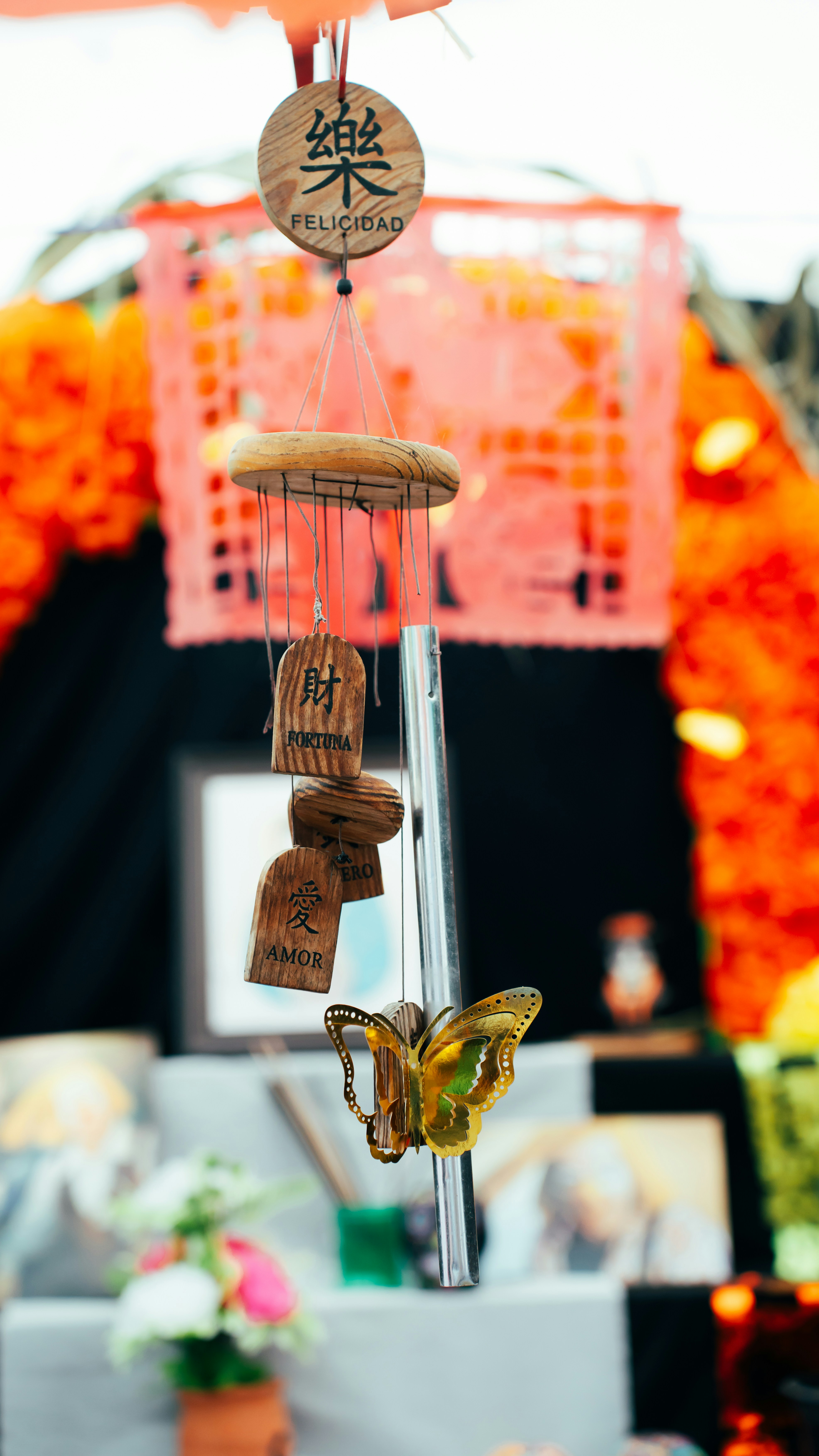 A wind chime with a butterfly on it