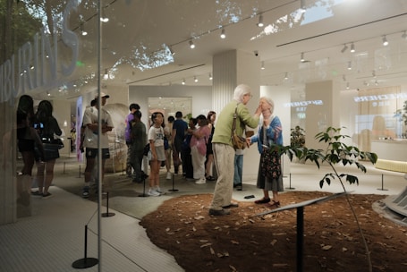 A group of people standing in a lobby