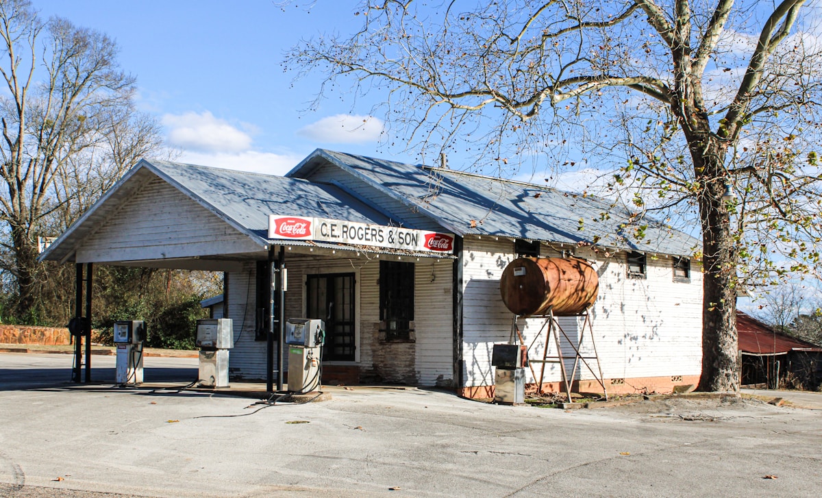 A roadside gas station under an open sky. Photo by Ronald Crow on Unsplash.