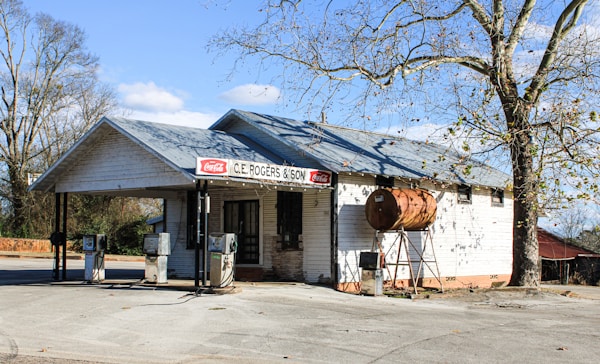 A roadside gas station under an open sky
