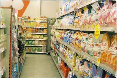 A grocery store aisle filled with lots of food