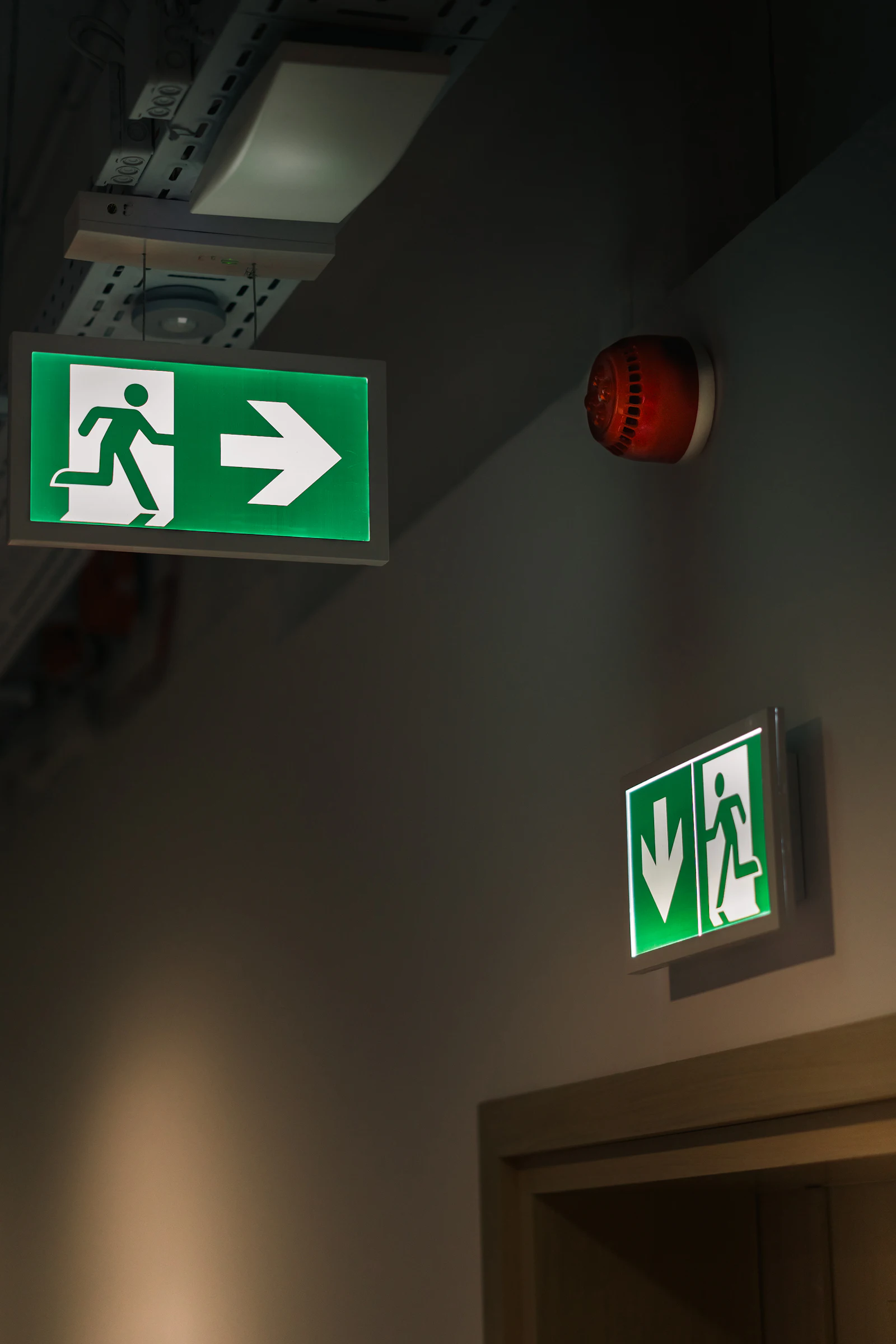 School corridor with fire doors and emergency exit signage