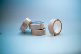 A stack of three wooden rings sitting on top of a table