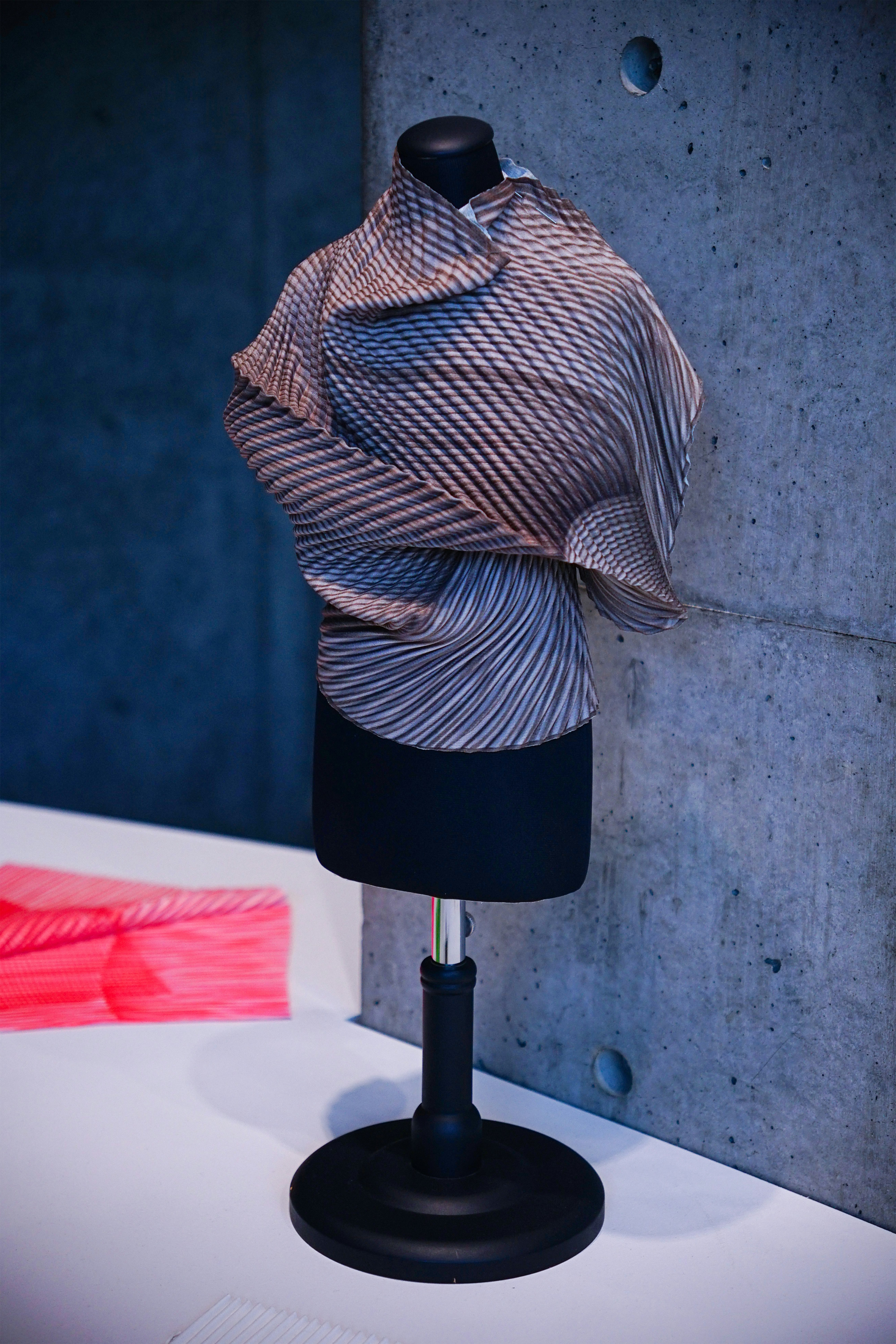 A mannequin with a scarf on top of it