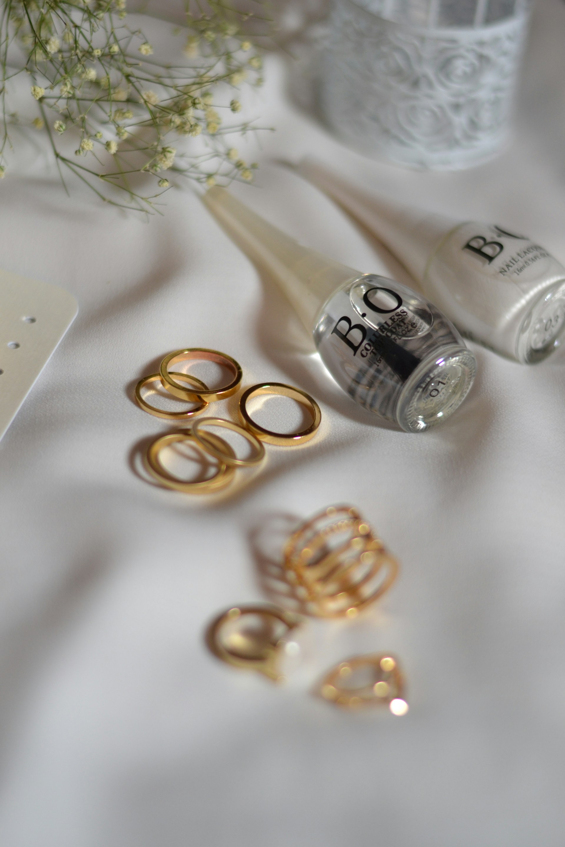 A table topped with gold rings and other items