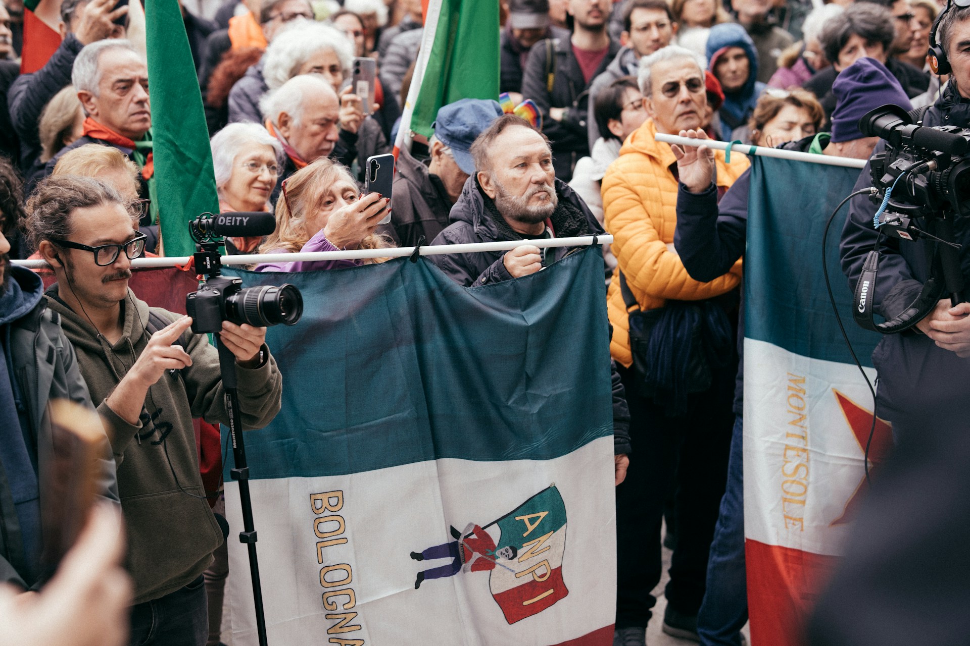 A crowd of people standing around each other