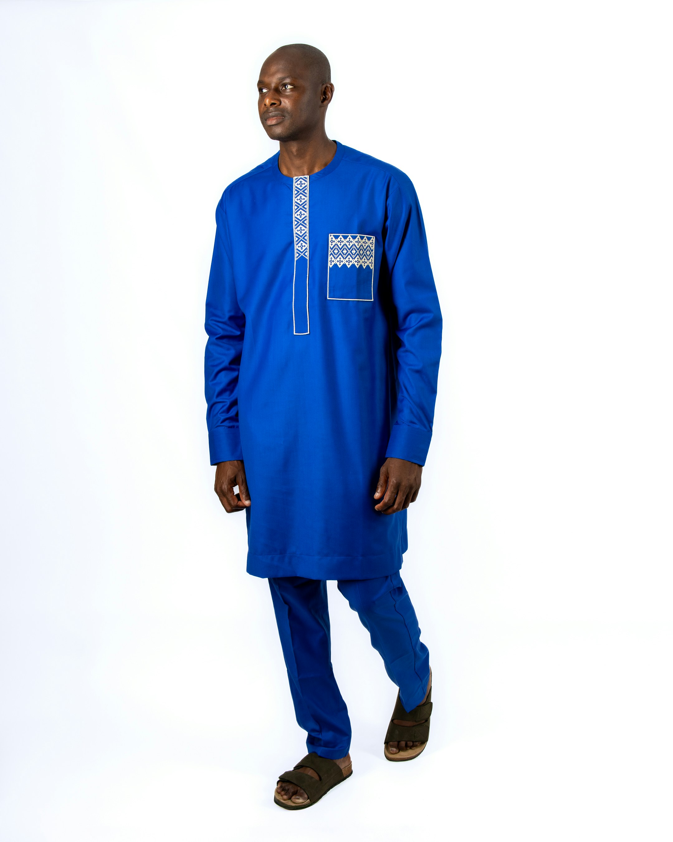 A man in a blue shirt and blue pants