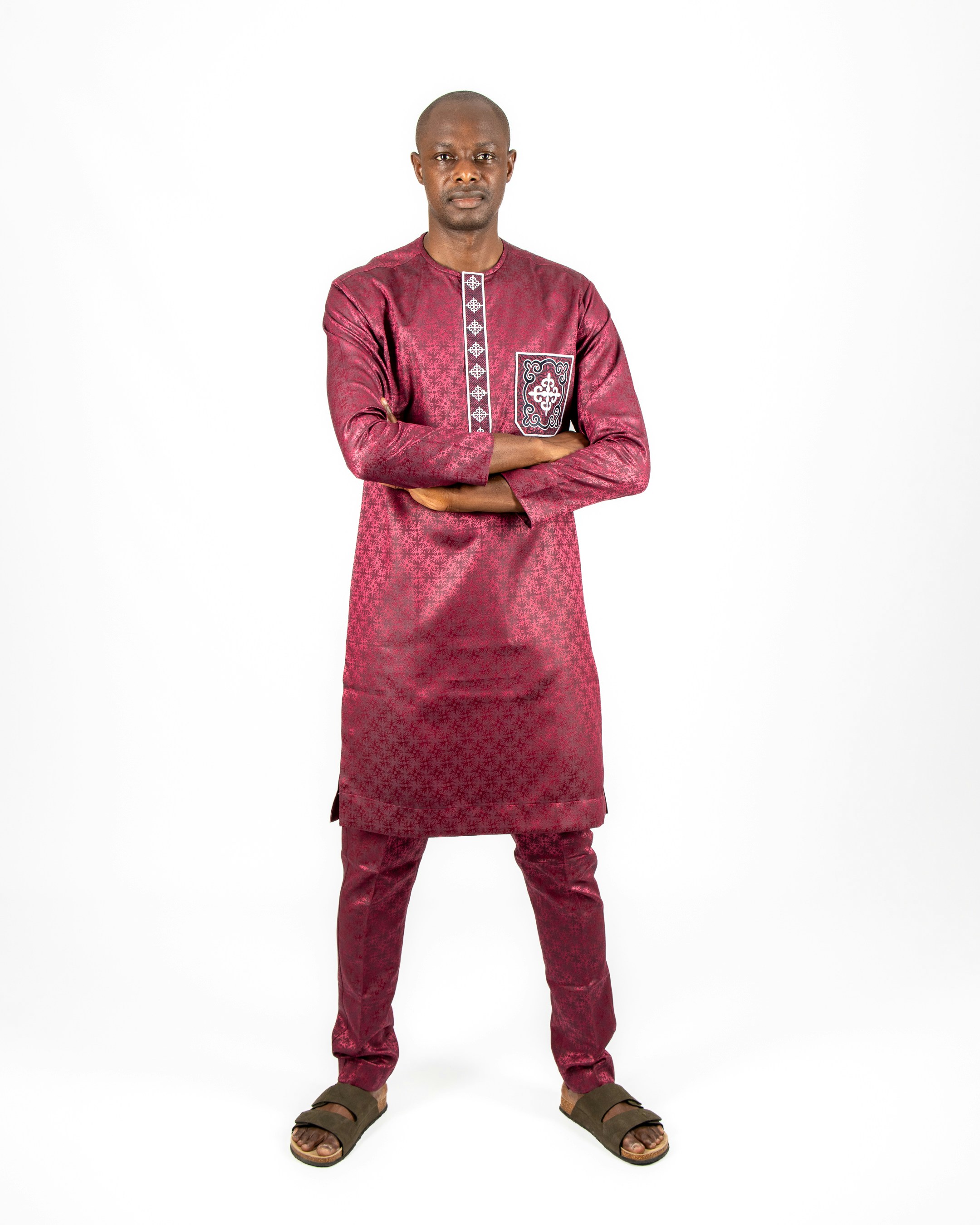 A man standing with his arms crossed in front of him