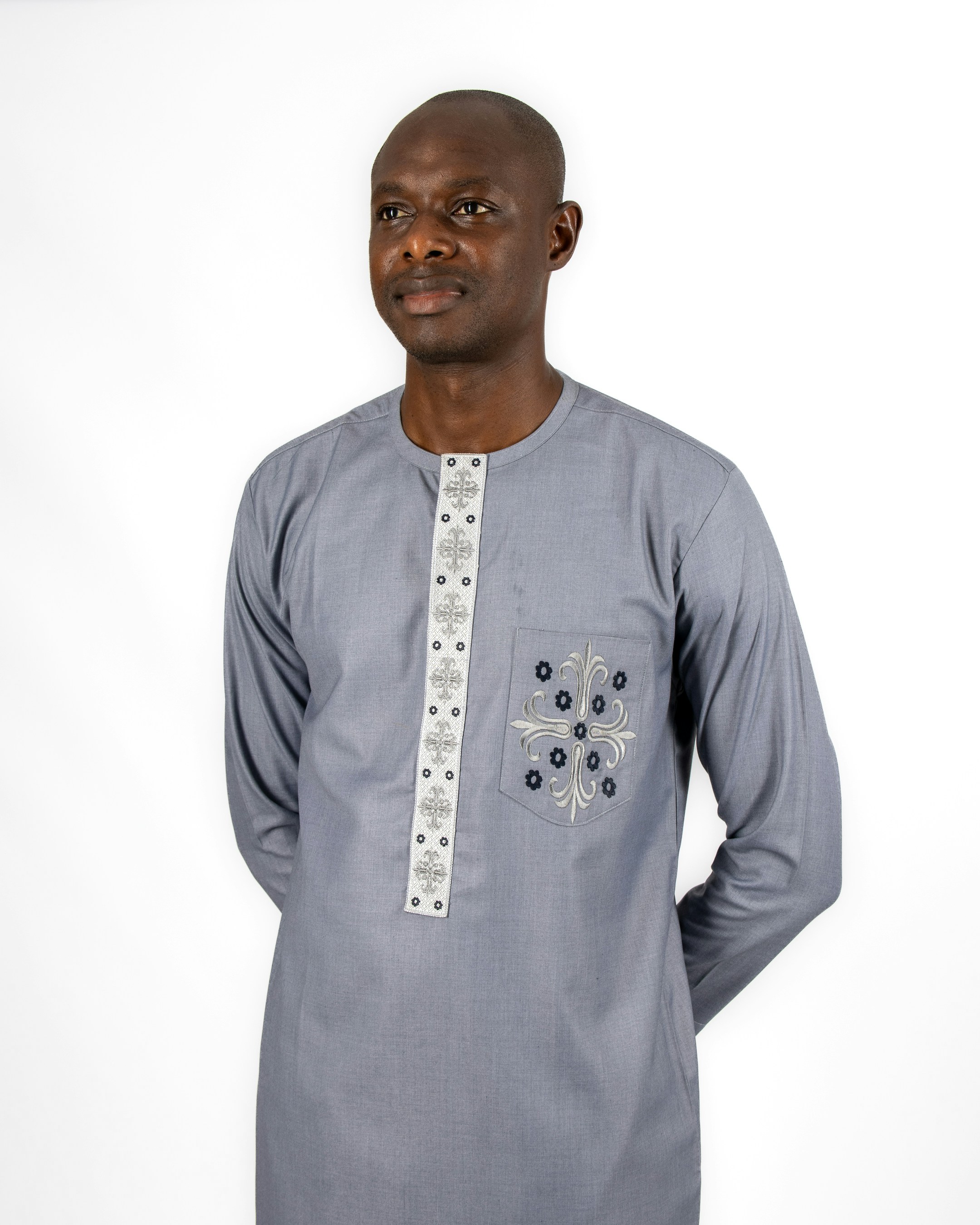 A man standing in front of a white background