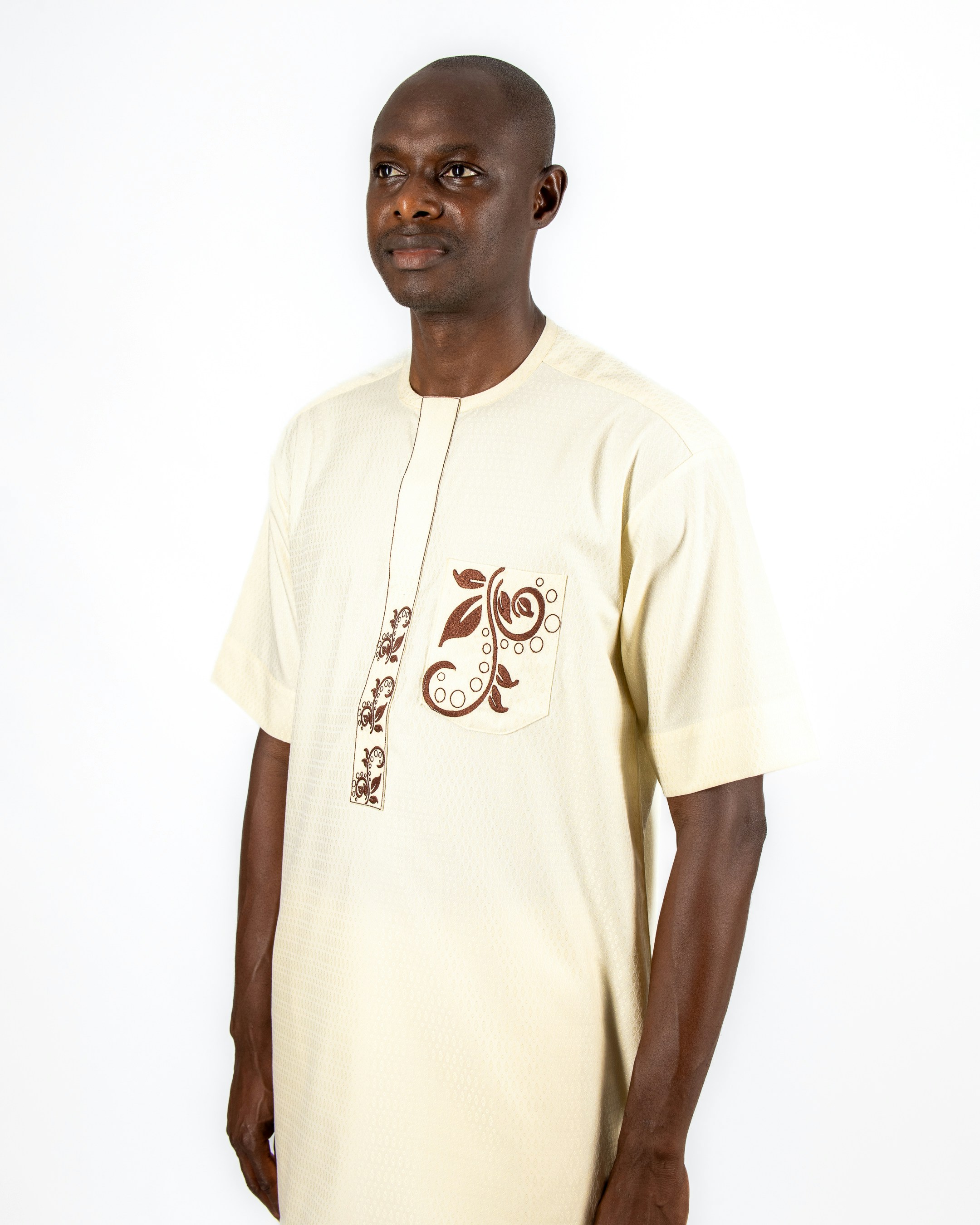 A man standing in front of a white wall