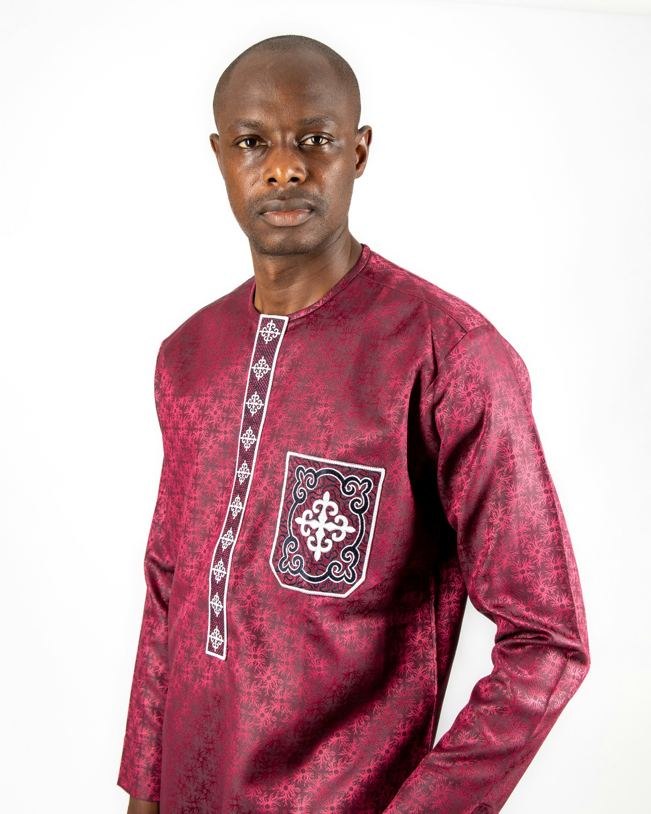 A man standing in front of a white background