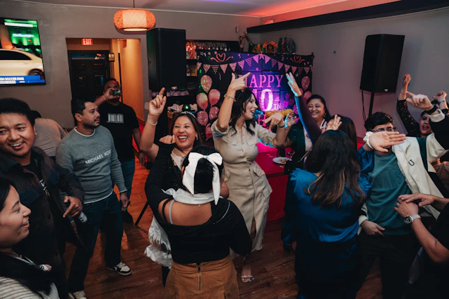 A group of people dancing in a room