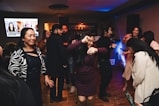 A group of people dancing at a party