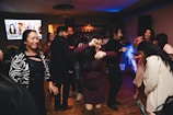 A group of people dancing at a party