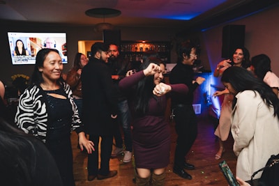 A group of people dancing at a party