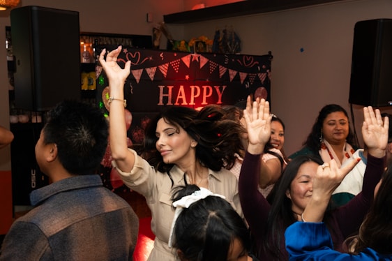 A group of people standing around each other