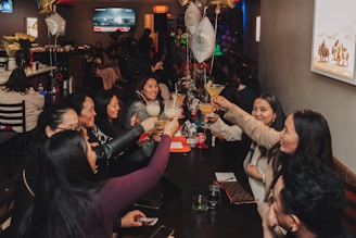 A group of people sitting around a table