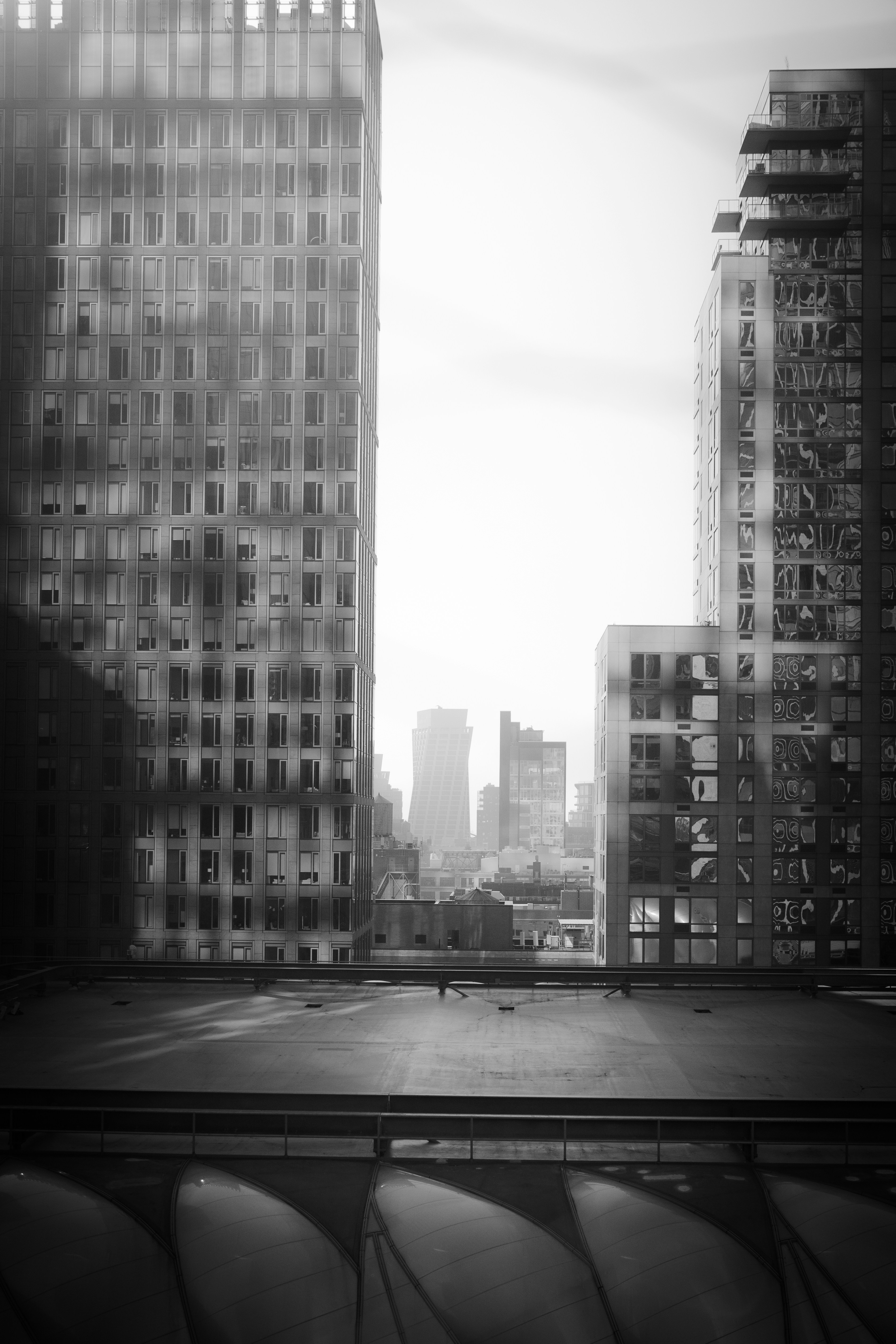 A black and white photo of a city skyline